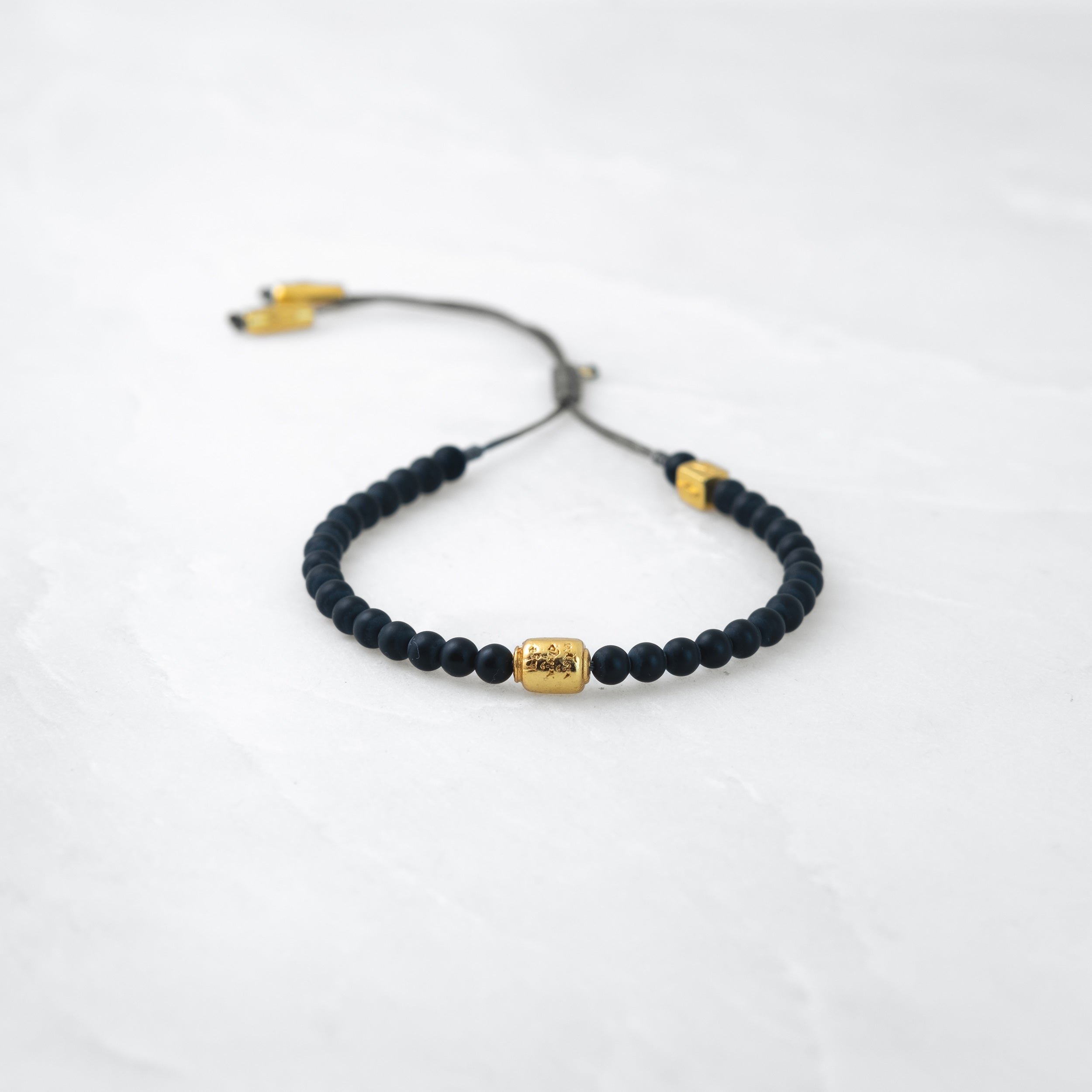 MALA bracelet - Basalt, gold Manikorlo