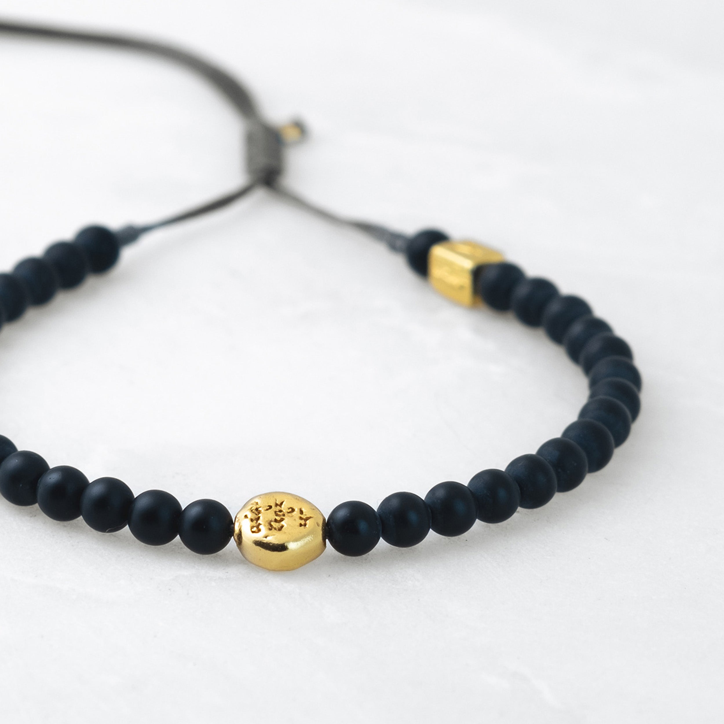 MALA bracelet - Basalt, golden Mani